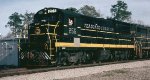 Seaboard Coast Line U18B #255, with the small fuel tank for branch line service, leading SCL train #330 thru the Southern Railway (Central of Georgia) interlocking 